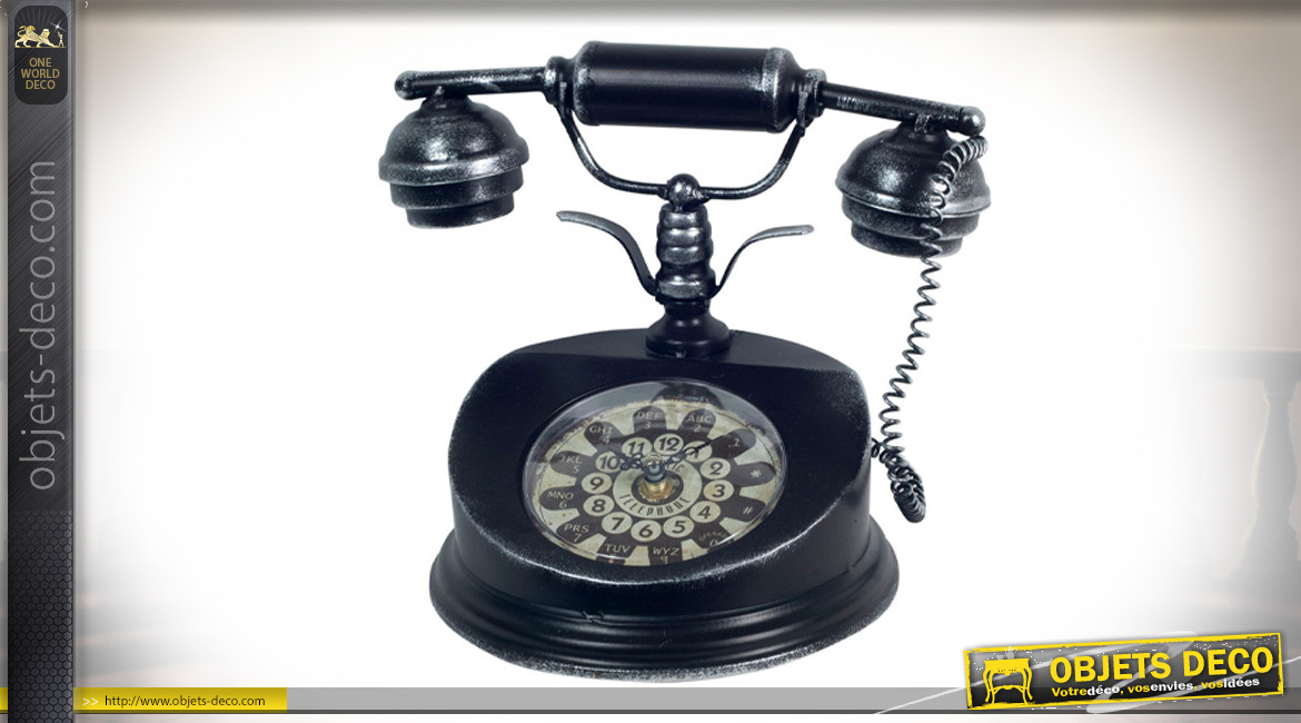 Ancien téléphone en métal avec horloge au centre, finition noir ancien patiné argent, 26cm