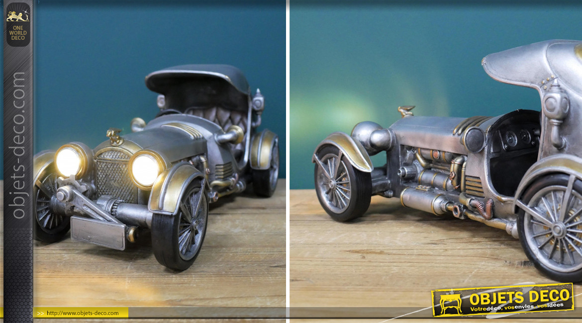 Représentation résine d'une voiture ancienne de style steampunk, avec phares, finition gris et laiton doré, 33cm