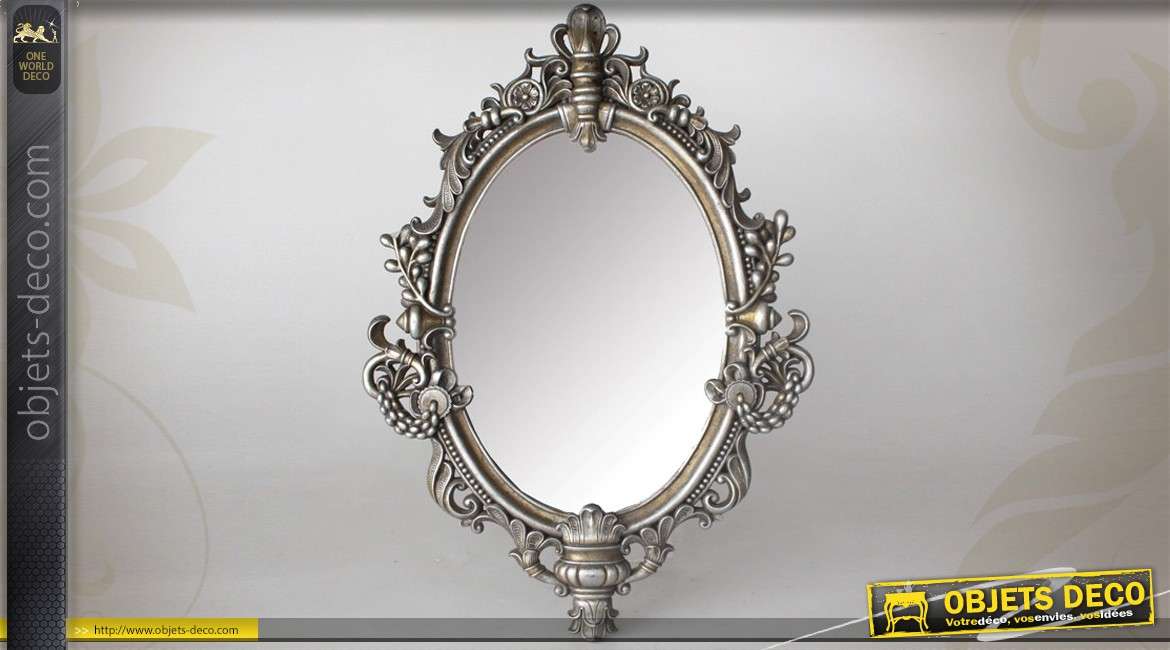 Miroir ovale style baroque argenté et vieilli 49 cm