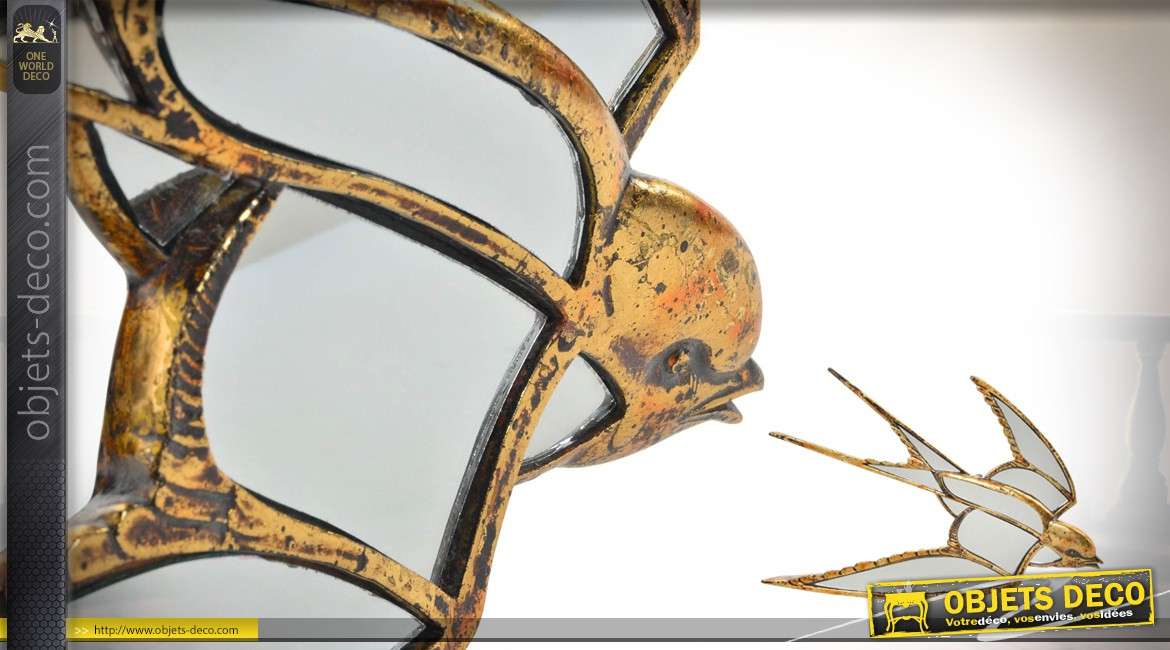Représentation d'une hirondelle en résine et miroir, finition dorée ancien, 40cm de long