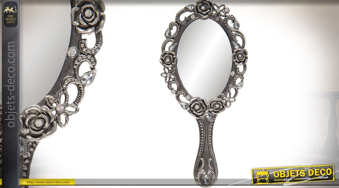 Miroir à main en métal finition argenté à motifs de fleurs en relief 18 cm