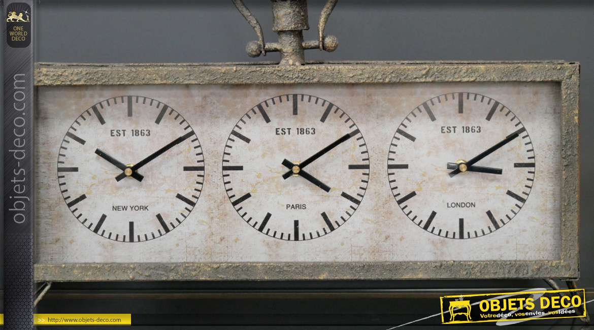 Horloge à poser en métal, trois cadrans finition oxydé patiné gris et reflets dorés