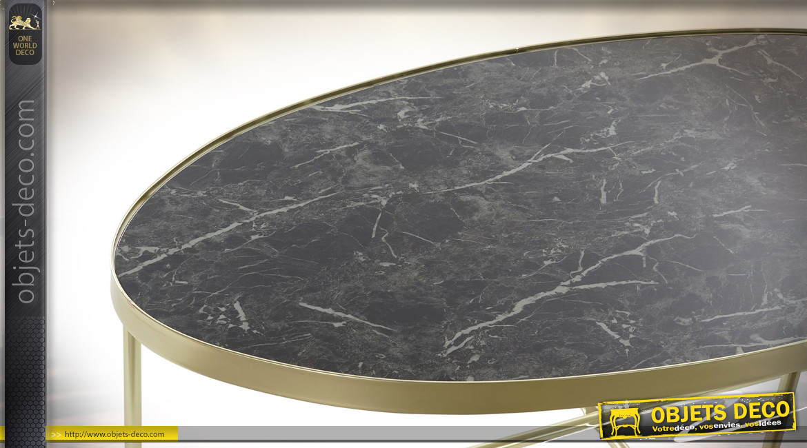 Table basse ovale en acier finition dorée et plateau en marbre noir ambiance rétro, 110cm