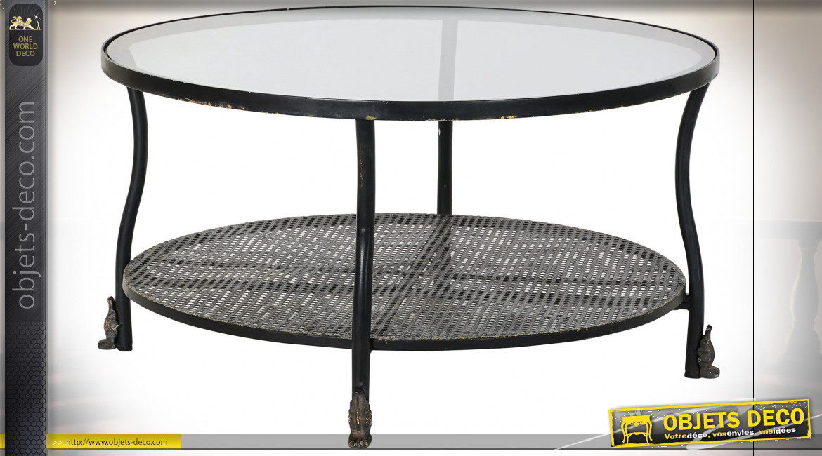 Table basse en métal finition noire et reflets dorés, plateau en verre transparent ambiance industrielle, Ø85cm