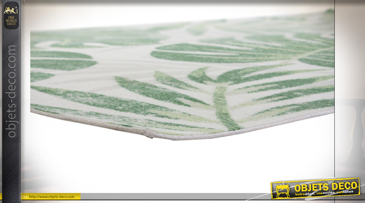 Grand tapis rectangulaire en polyester finition blanche et verte aux motifs de feuilles tropicales, 290cm