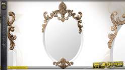 Miroir ovale de style baroque ornements métal doré antique