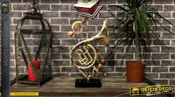 Trophée déco sur le thème de la musique avec instruments sur fond de portée de solfège, en métal, 46cm